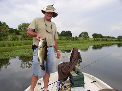 Dave Carlisle with 8 lb bass, Aug. 03