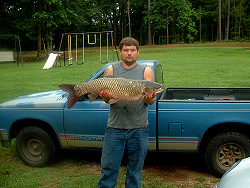 Jessie Holifield with 22 lb grass carp from Donavan Lake
