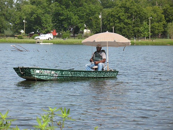 John Heard, Marion, keeps cool while bass fishing in July.