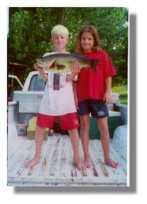 Hudson Wilson and sister Lauren on Lake Ely pier