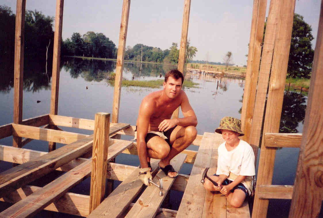 Chad and Hudson Wilson working on a pier on Snag Lake