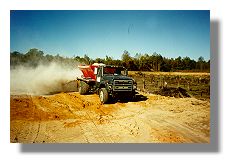 Gus Fikes spreading lime in Snag Lake